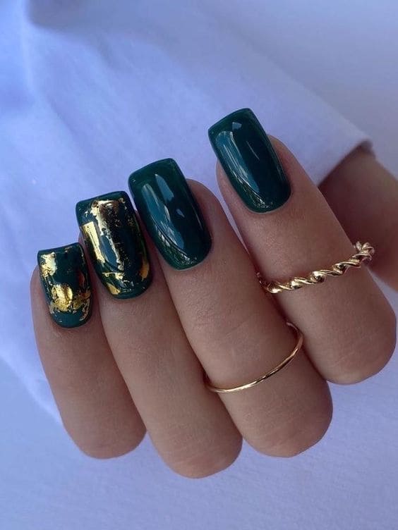 Dark green nails with gold foils