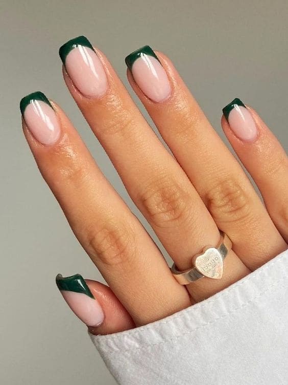 Dark green French tips on milky white short nails