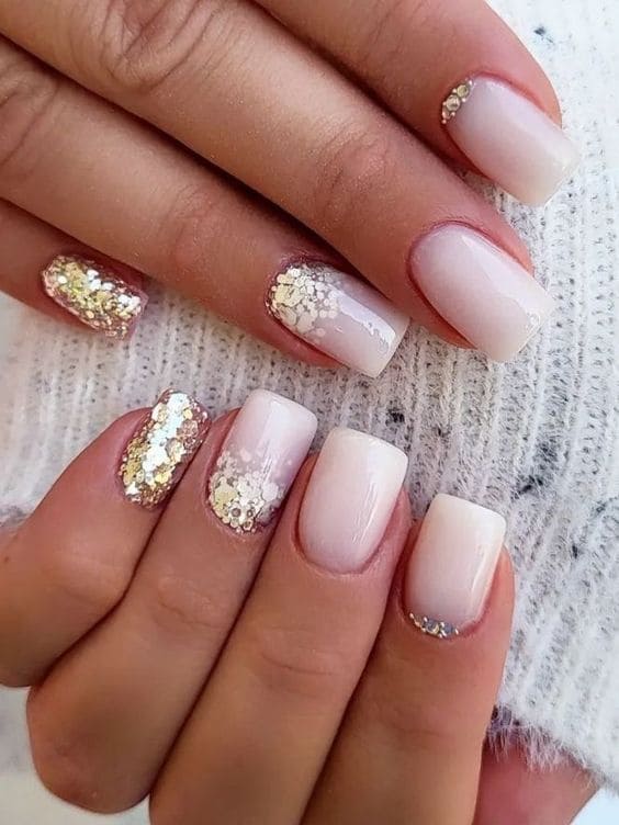 Short milky nails with glitter 