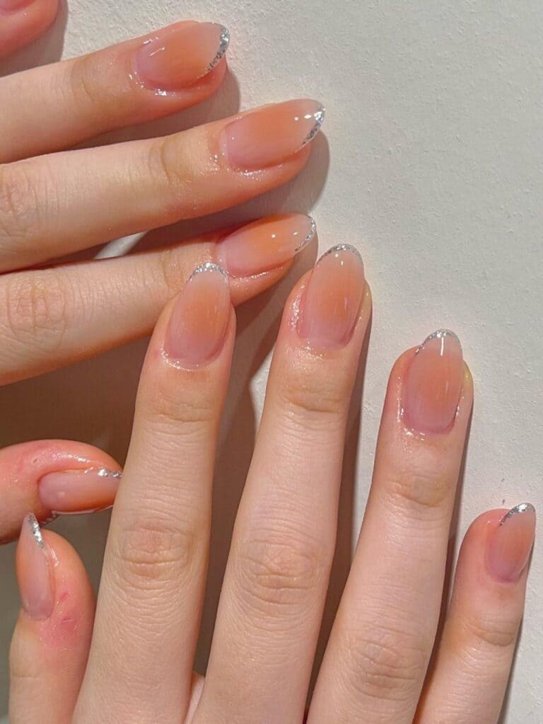 Korean blush nails with glittery tips
