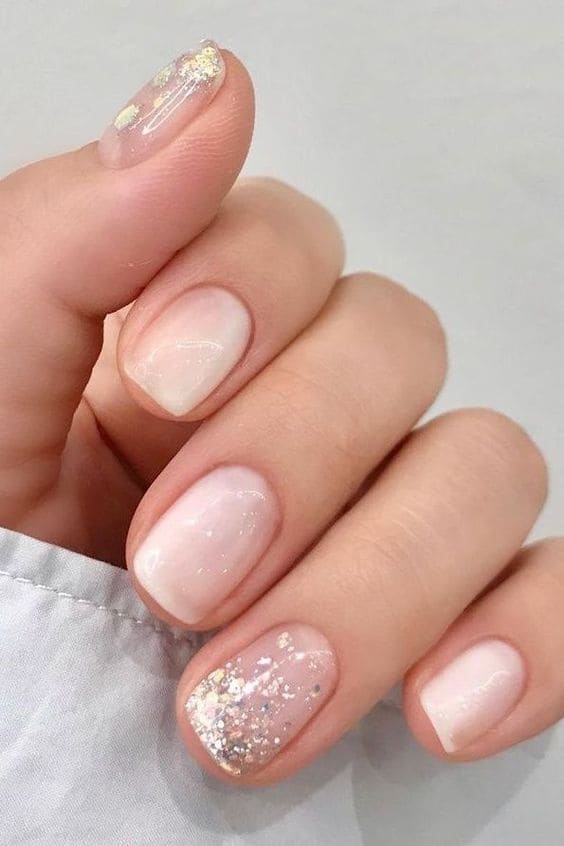Short milky white nails with glitter