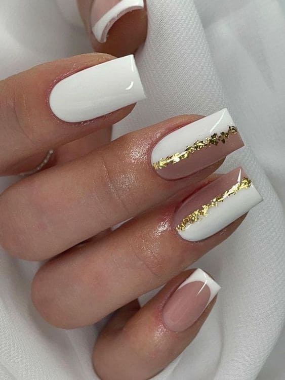 White nails with a  gold foil accent