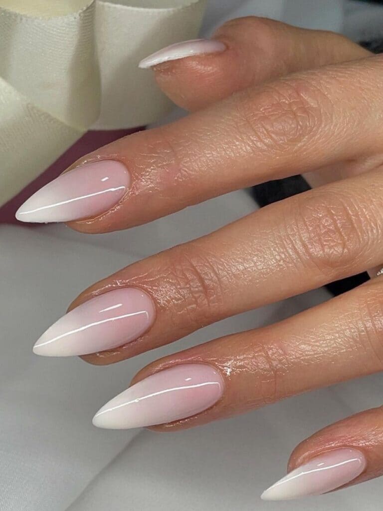 Stiletto-shaped, white and pink ombre nails 