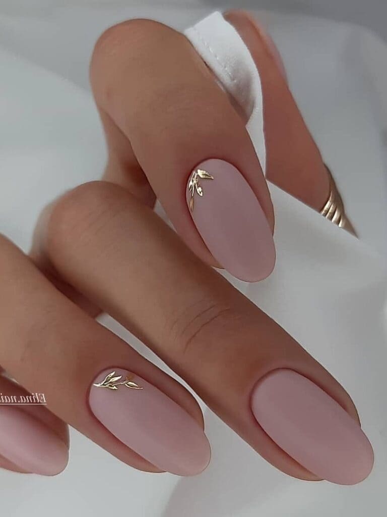 matte, nude pink short nails with gold leaves