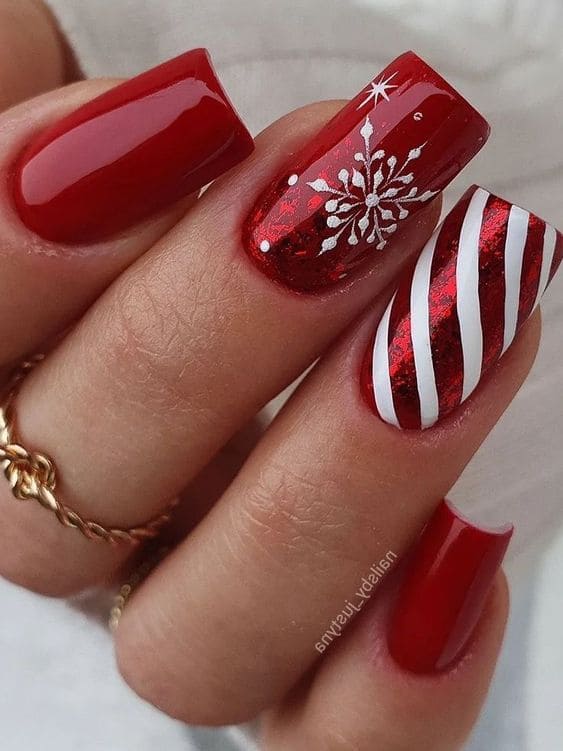 red acrylic nails with candy cane stripes