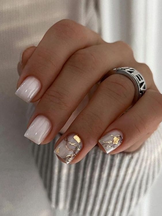 short milky white nails with gold foils 