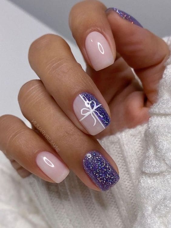 milky white and shimmery purple short nails with a Christmas gift