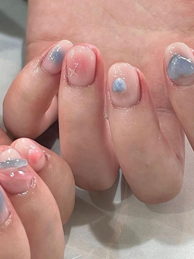 subtle blue and pink Korean blush nails