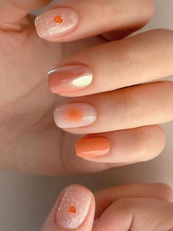 peach cheek nails with glitter