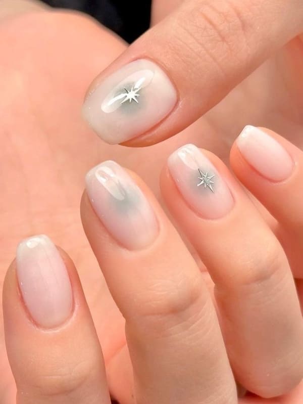 milky white nails with chrome sparkles