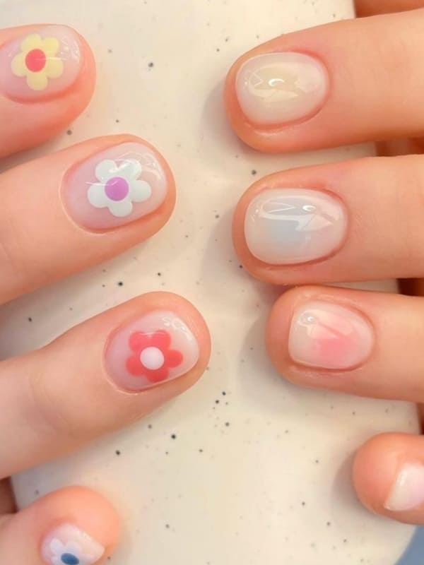 Korean blush nails with floral accents