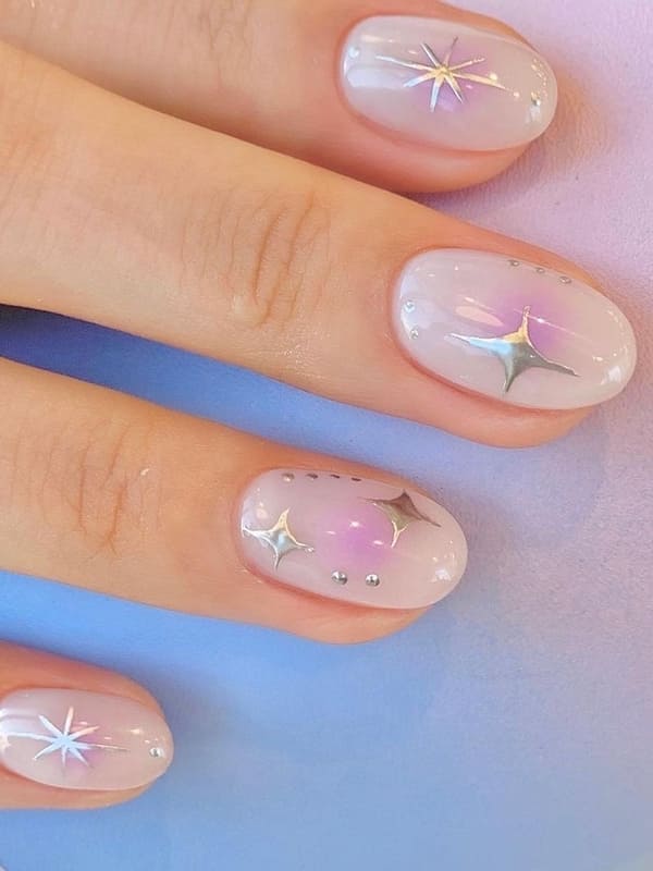 milky white nails with chrome sparkles