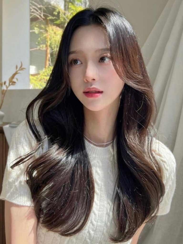 Korean ash brown hair color and long wavy hairstyle