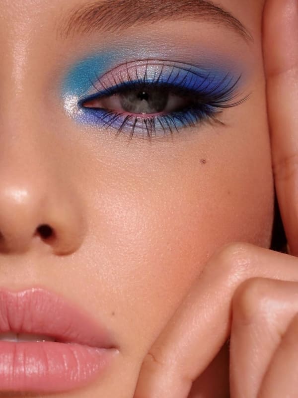 blue eye makeup look with nude lips for 4th of July