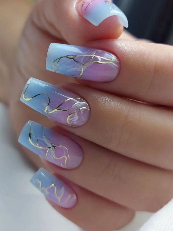 baby blue and pink ombre nails with swirls