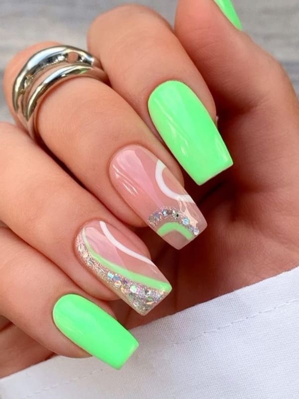 neon green nails with swirls 
