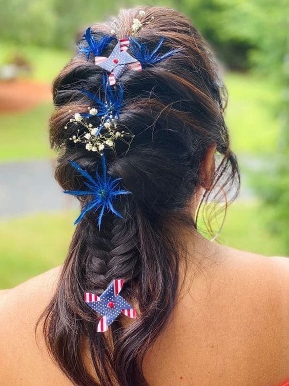 half up braided hairstyle with 4th of July hair accessories 