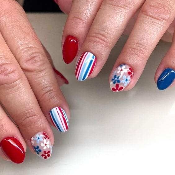 blue and red nails with flowers 
