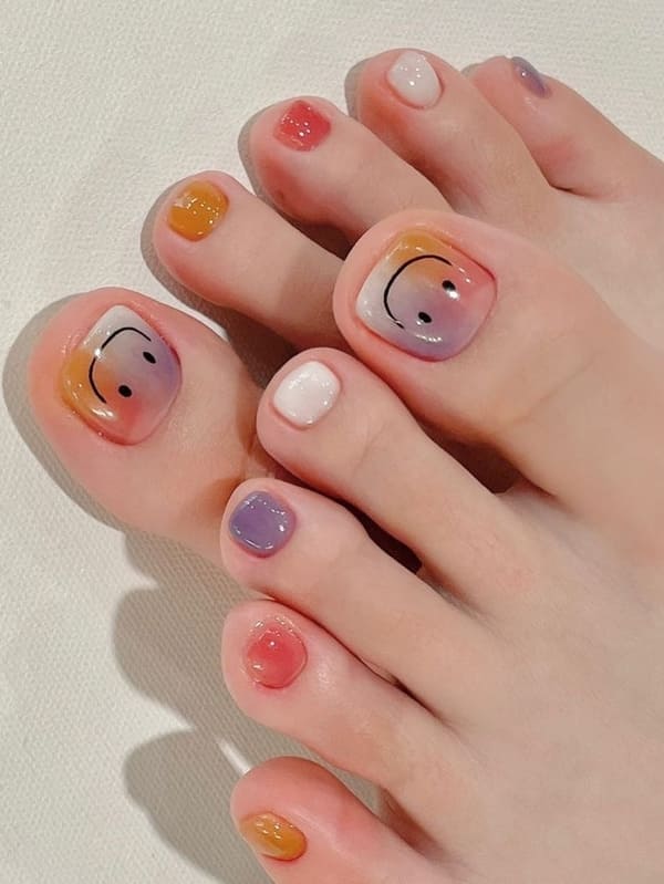 marble toenails with a smiley face
