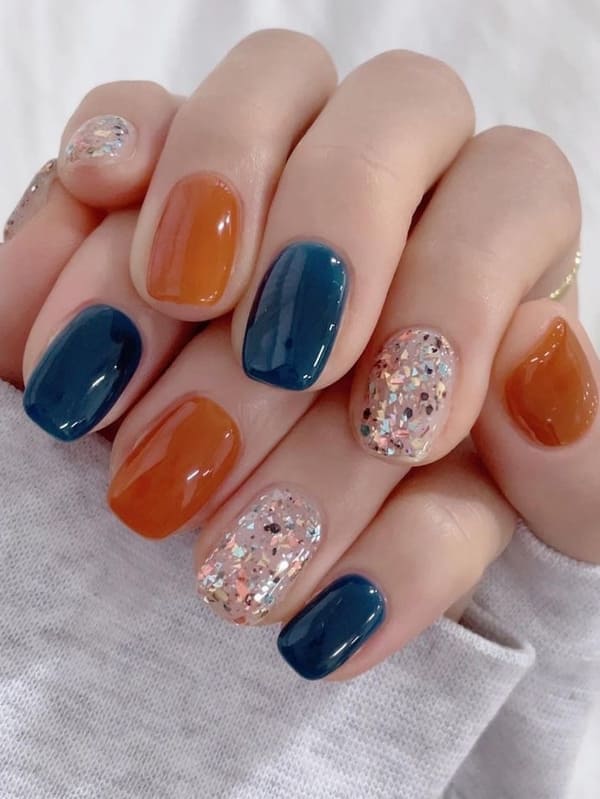 caramel orange and dark blue nails