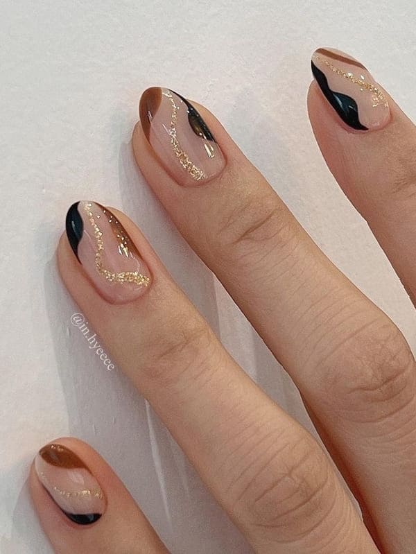 two tone brown nails with a swirl accent