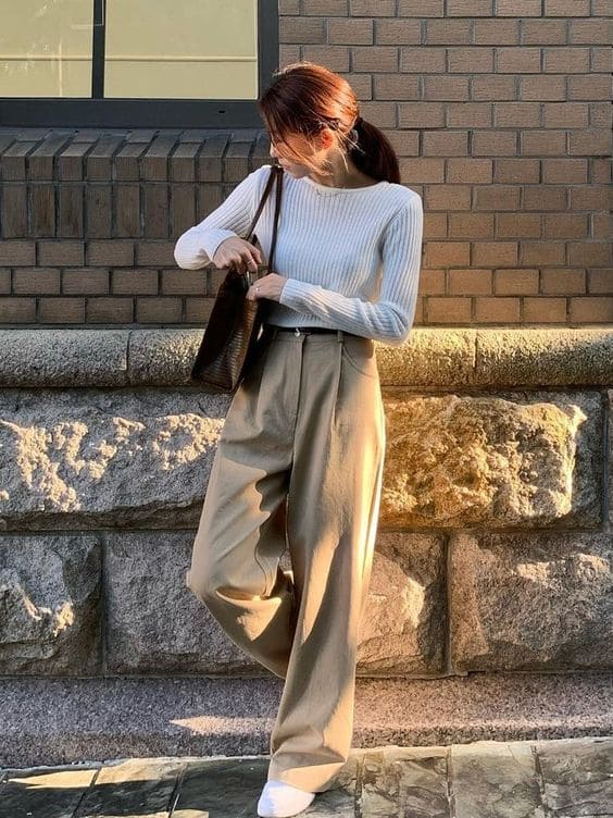 sweater and beige pants