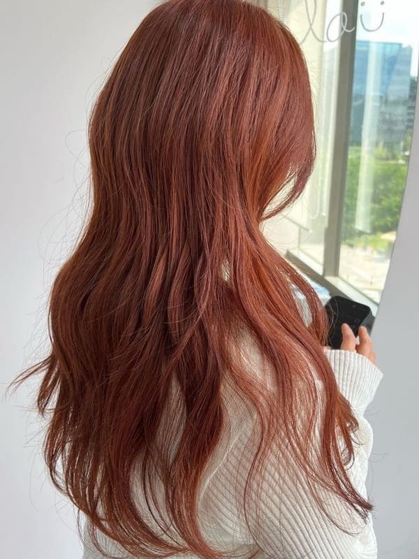 Korean fall hair color: orange brown long waves