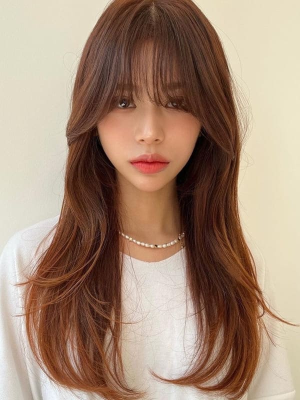Korean fall hair color: orange brown long hair with wispy bangs