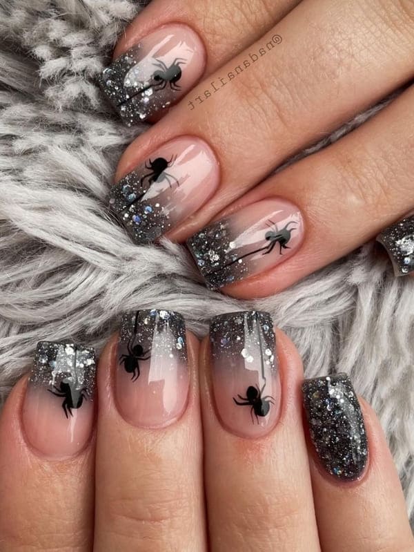 shimmery black spider nail design 