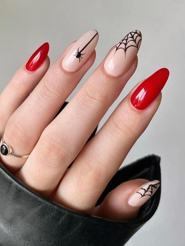 red nails with spider webs