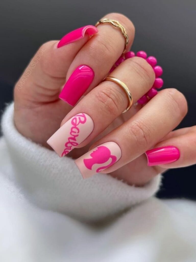 barbie pink nails with a logo