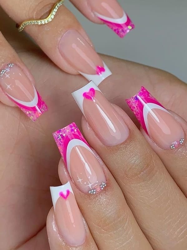 pink and white French tips with heart accents