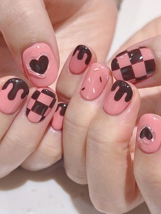 brown and pink nails with a 3d heart ring