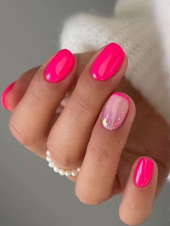 hot pink nails with a French tip accent 