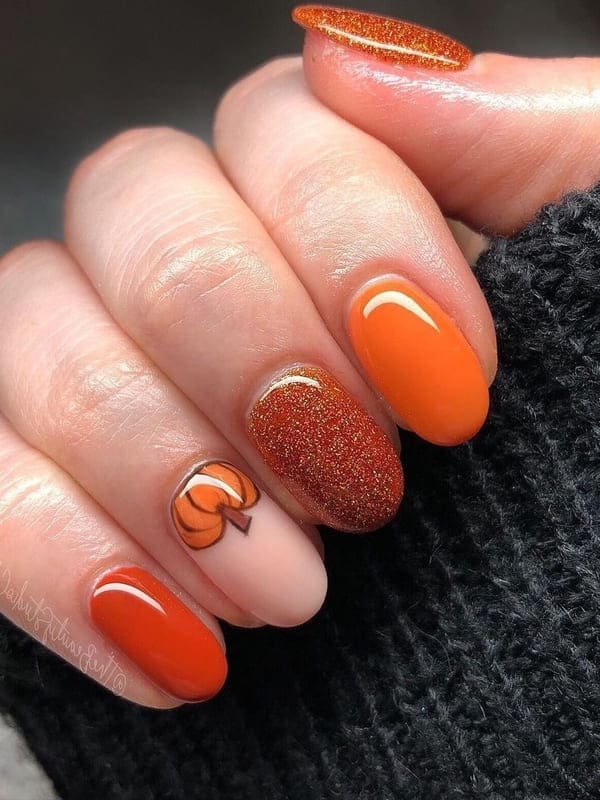 burnt orange nails with pumpkin 