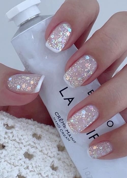 white French tips and glitter 