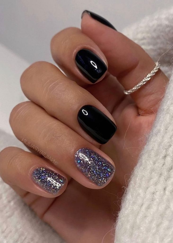 new years eve nails: solid black and silver glitter