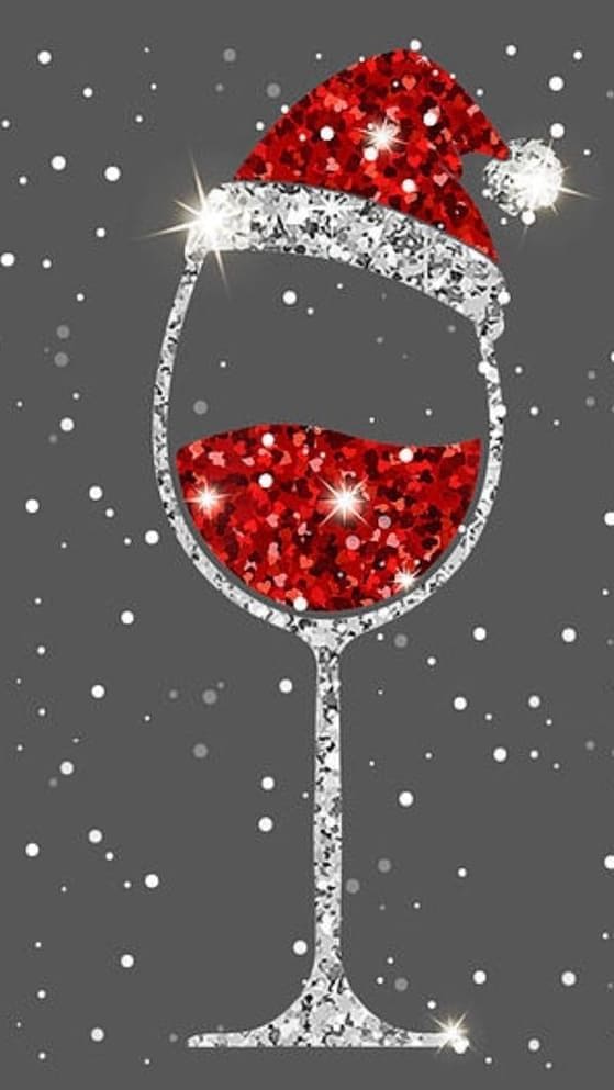 a glittery Santa hat and wine glass 