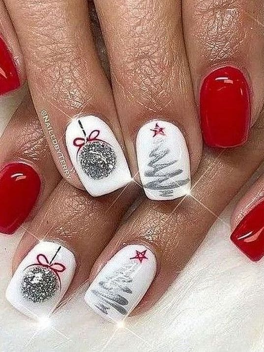 classic red nails with tree accent