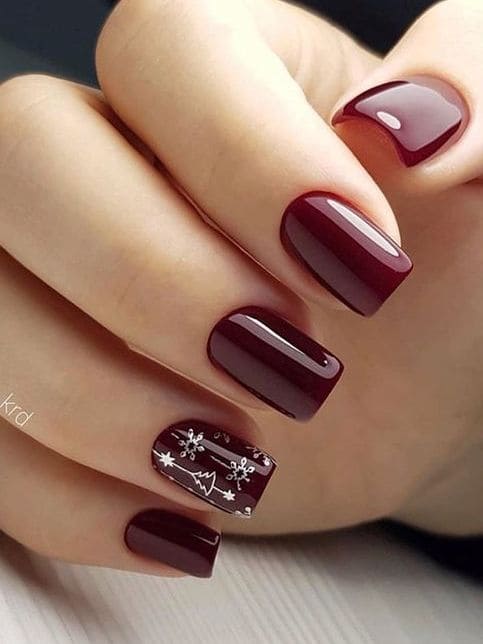 burgundy nails with a silver line accent 