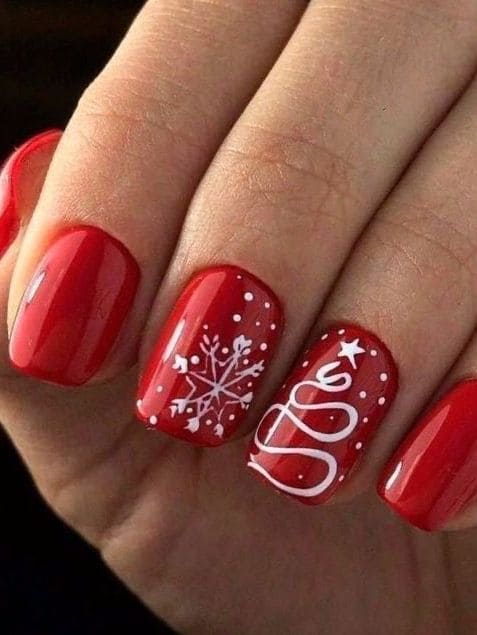 classic red nails with tree accent 