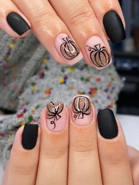 black short nails with pumpkin accents