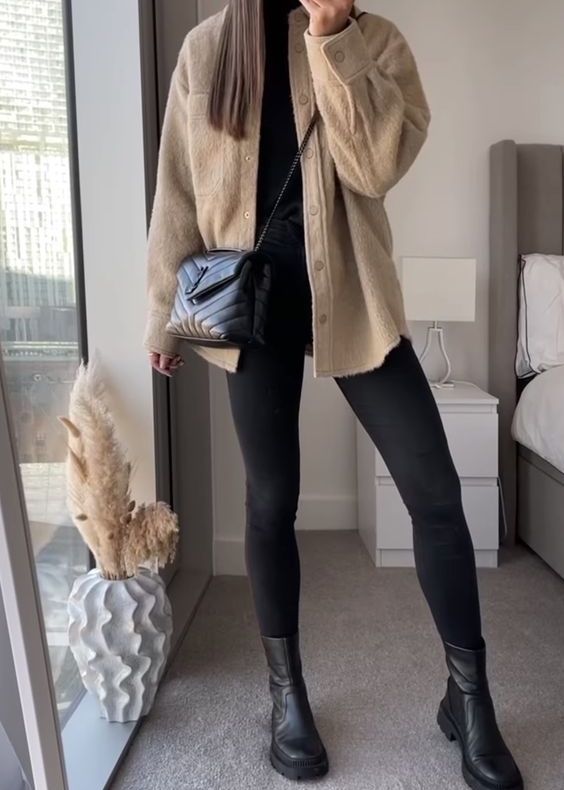 beige wool button down shirt and black leggings 