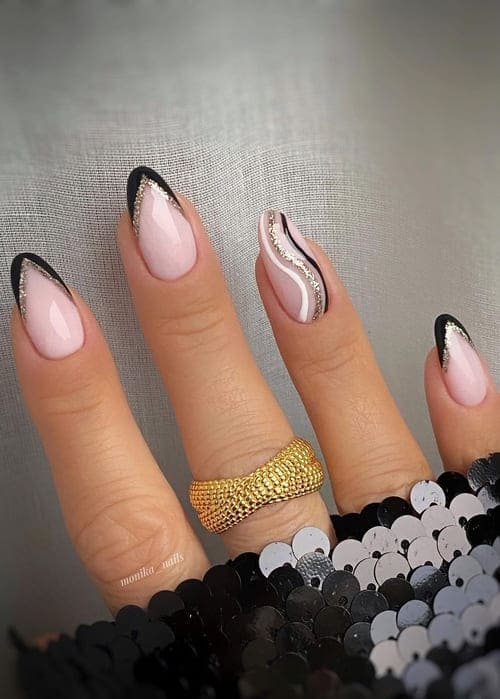 black and gold glitter French tips 
