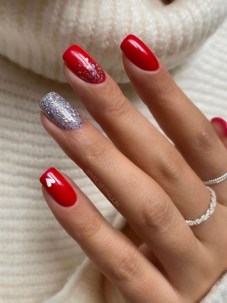 red Christmas nails with a silver glitter accent