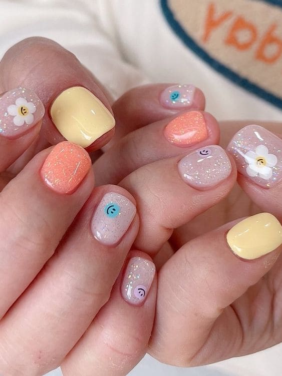 cute emoji mix and match nails 