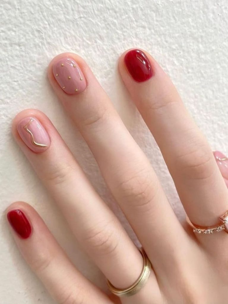 Korean burgundy and gold nails: minimalistic design