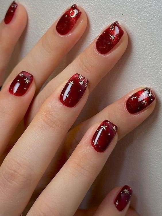 Korean burgundy and gold nails: snowflake accents 