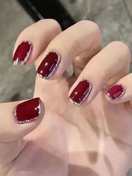 Korean burgundy and gold nails: geometric lines