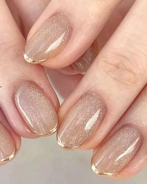 classy gold nails: chrome French tips